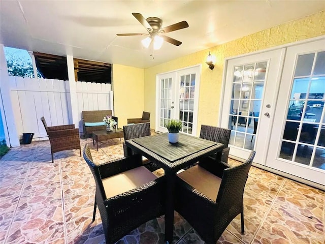 117B E Mezquite St, South Padre Island, TX 78597 - view of patio / terrace featuring french doors, fence, ceiling fan, and outdoor dining space