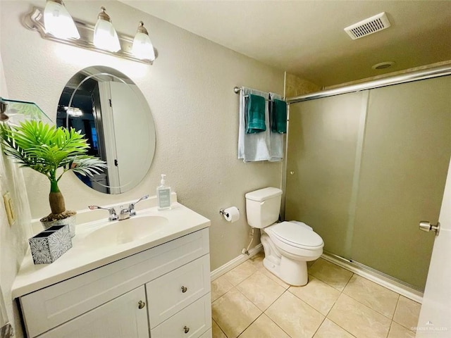117B E Mezquite St, South Padre Island, TX 78597 - bathroom with toilet, a shower stall, tile patterned floors, vanity, and baseboards