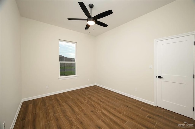 empty room featuring dark hardwood / wood-style floors and ceiling fan