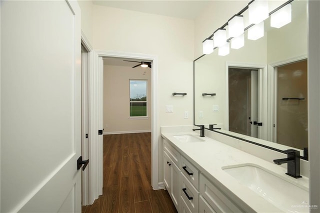 bathroom featuring hardwood / wood-style floors, vanity, and ceiling fan