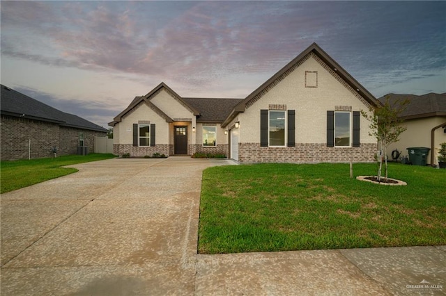 view of front of home with a yard