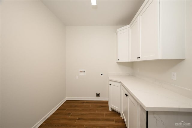 washroom featuring electric dryer hookup, dark hardwood / wood-style floors, cabinets, and hookup for a washing machine