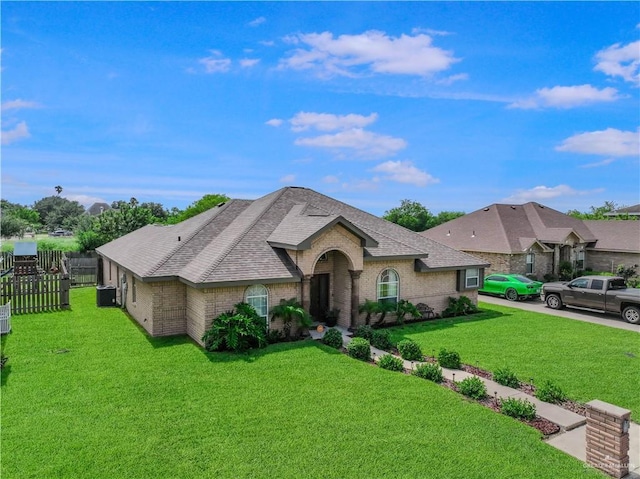 315 Oregano St, Edinburg, TX 78541 - french country inspired facade with brick siding and a shingled roof
