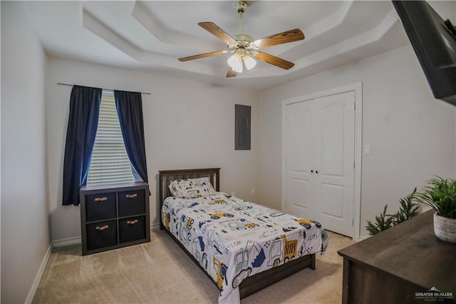 315 Oregano St, Edinburg, TX 78541 - bedroom with a raised ceiling, light colored carpet, electric panel, a closet, and a ceiling fan