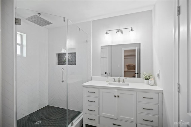 315 Oregano St, Edinburg, TX 78541 - bathroom with a shower stall, vanity, and a walk in closet