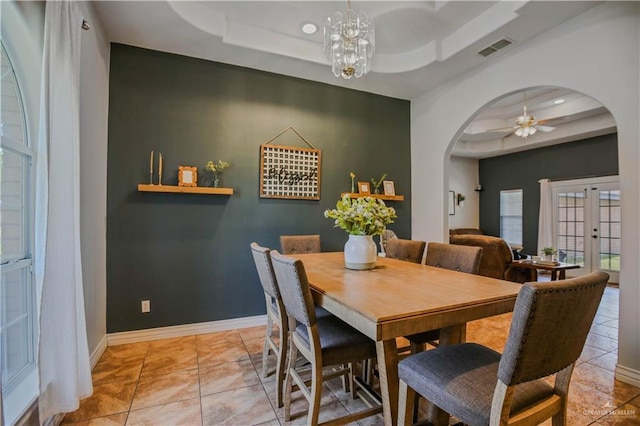 315 Oregano St, Edinburg, TX 78541 - dining room featuring a tray ceiling, arched walkways, a ceiling fan, and french doors