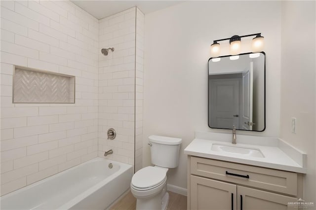 1202 N Lincoln Ave, San Juan, TX 78589 - bathroom with vanity, toilet, bathtub / shower combination, baseboards, and wood finished floors
