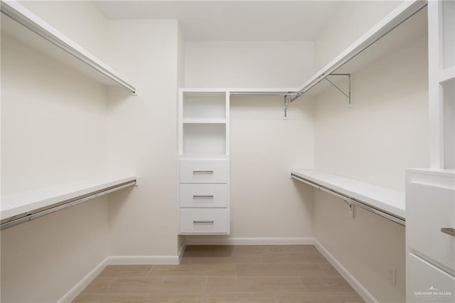 1202 N Lincoln Ave, San Juan, TX 78589 - walk in closet featuring light wood-type flooring