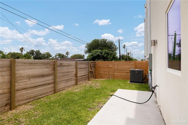1202 N Lincoln Ave, San Juan, TX 78589 - view of yard featuring central air condition unit and a patio area