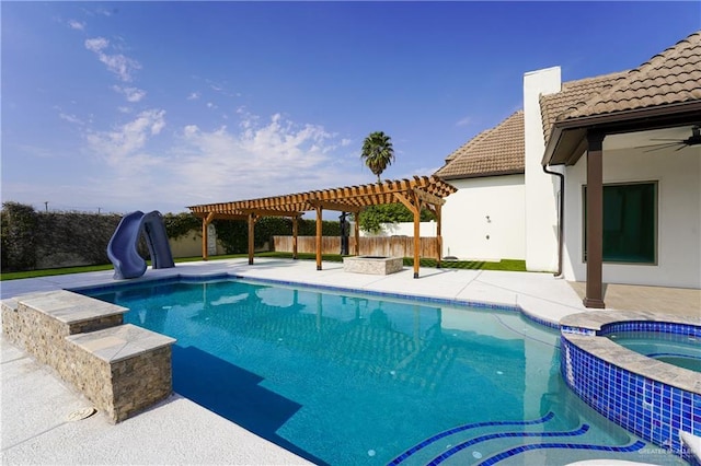 view of pool featuring an in ground hot tub, a water slide, a patio area, and a pergola