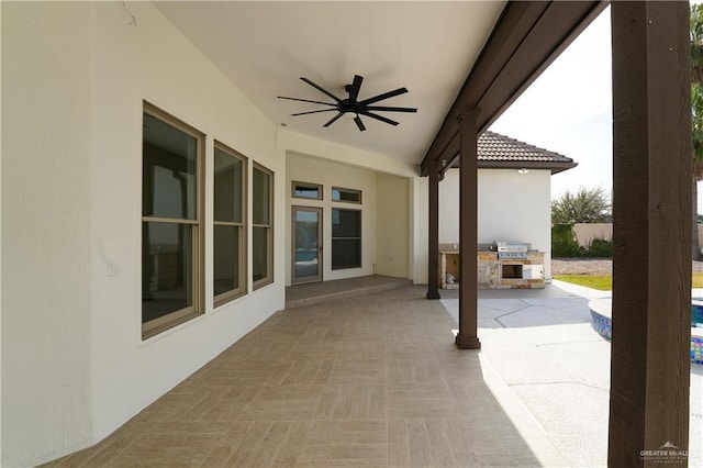 view of patio / terrace featuring area for grilling and ceiling fan