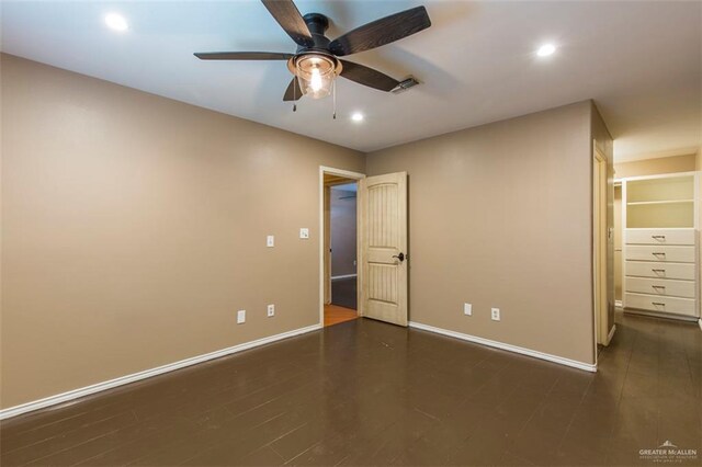 4009 Wescan Ln, Mission, TX 78572 - unfurnished bedroom with ceiling fan, dark hardwood / wood-style flooring, and a spacious closet