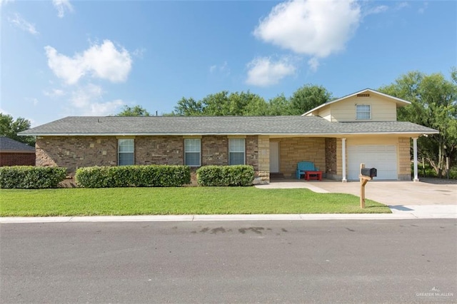 view of front of property with a front lawn and a garage