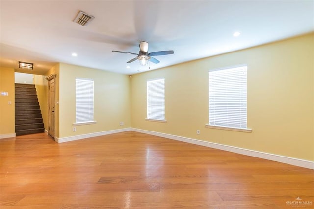 unfurnished room featuring ceiling fan and light wood-type flooring