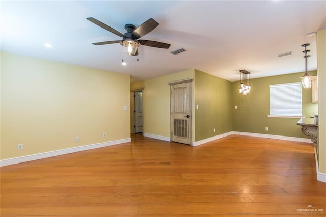 spare room with ceiling fan and light hardwood / wood-style floors