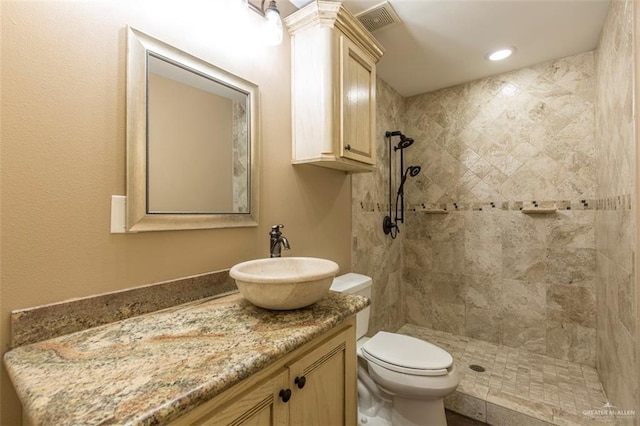 4009 Wescan Ln, Mission, TX 78572 - bathroom with tiled shower, vanity, and toilet