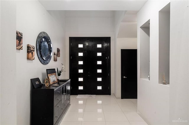 entrance foyer featuring light tile patterned floors