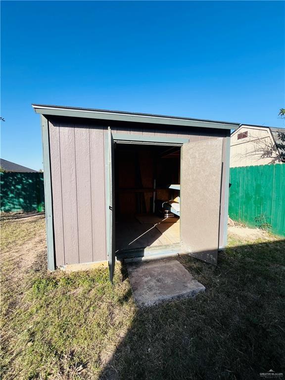 view of outdoor structure with a lawn