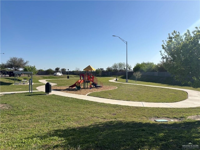 community playground featuring a lawn