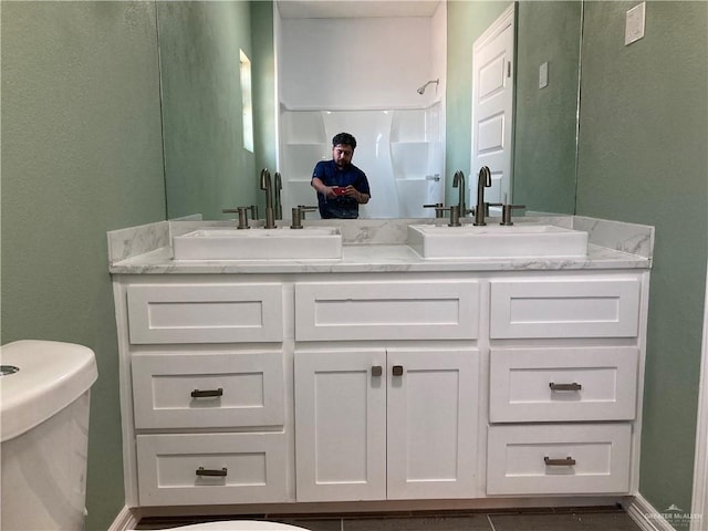 bathroom with vanity and toilet