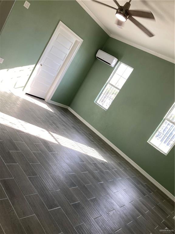 unfurnished room with ceiling fan, crown molding, a healthy amount of sunlight, and dark hardwood / wood-style floors