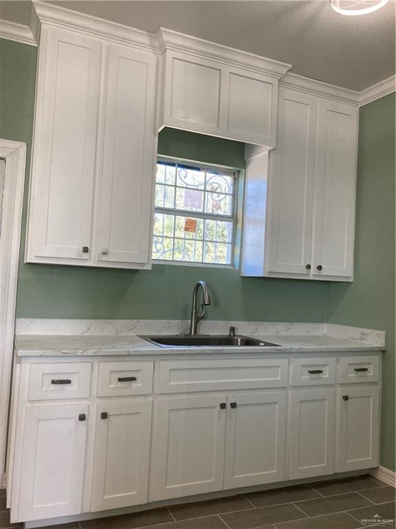 kitchen with sink and white cabinets