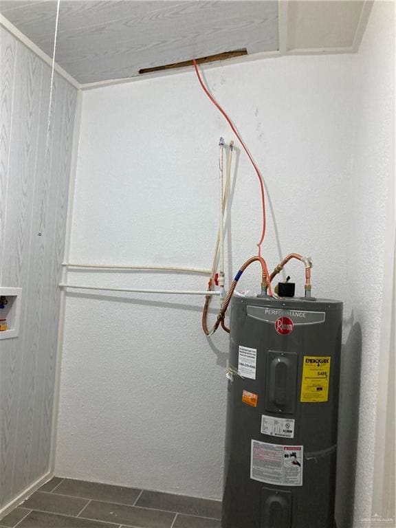 utility room featuring electric water heater