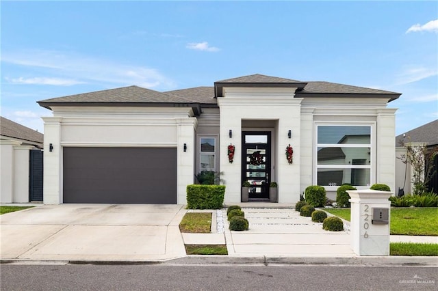 prairie-style home featuring a garage