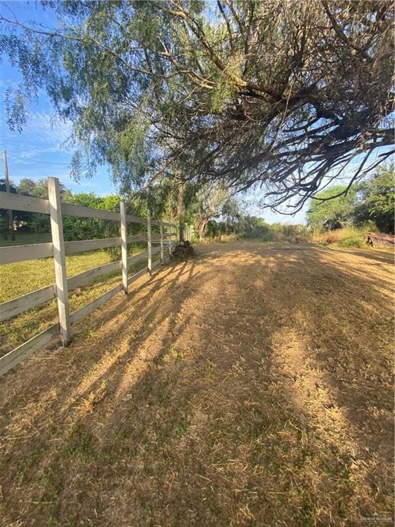 view of yard with a rural view