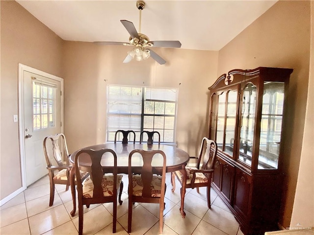 dining space with ceiling fan and light tile patterned floors