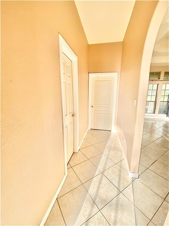 hallway featuring light tile patterned floors