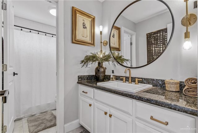 bathroom with vanity and curtained shower