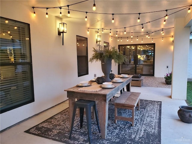 dining area featuring concrete flooring