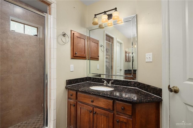 bathroom with vanity and an enclosed shower