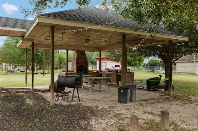 surrounding community with a lawn and a patio area