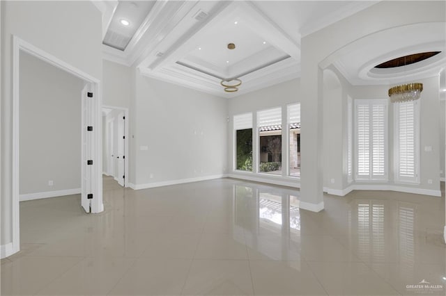 unfurnished living room featuring a healthy amount of sunlight, crown molding, coffered ceiling, and a towering ceiling