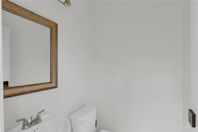 bathroom with sink and toilet