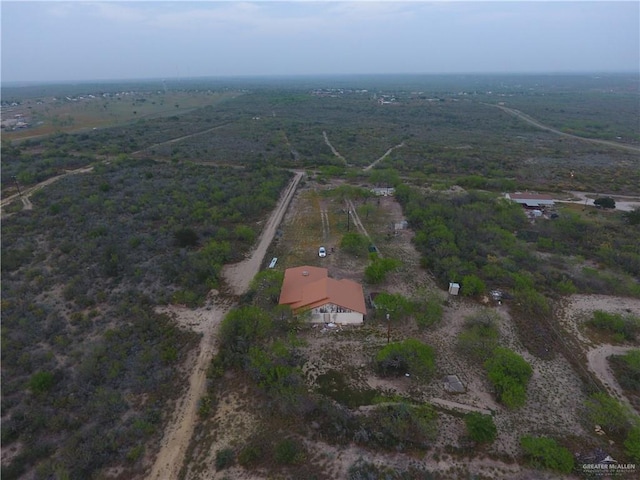 birds eye view of property with a rural view