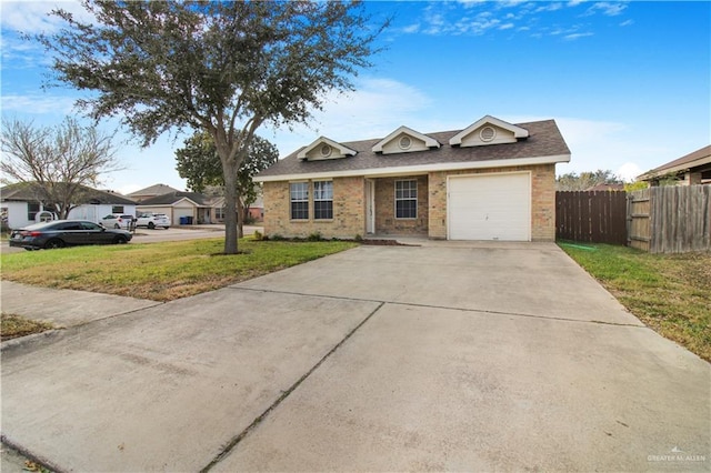 ranch-style home with a garage and a front lawn