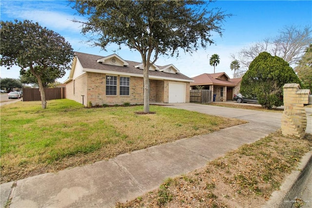 view of front of house featuring a garage and a front yard