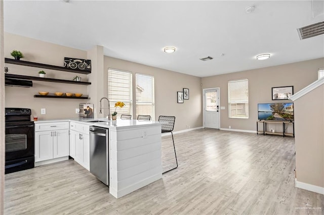 6009 Midcrown Dr, San Antonio, TX 78218 - kitchen featuring black / electric stove, dishwasher, a sink, light wood-style flooring, and extractor fan