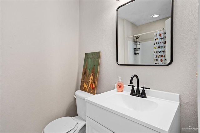 6009 Midcrown Dr, San Antonio, TX 78218 - full bathroom featuring vanity, toilet, a shower with shower curtain, and a textured wall