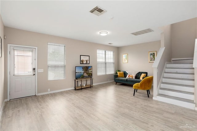 6009 Midcrown Dr, San Antonio, TX 78218 - sitting room featuring light wood-type flooring, stairs, and baseboards