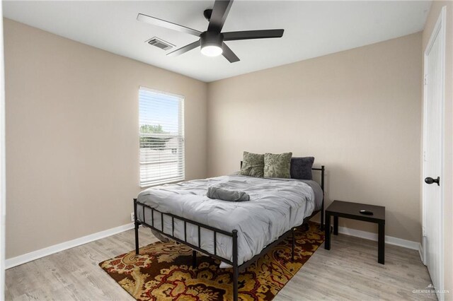 6009 Midcrown Dr, San Antonio, TX 78218 - bedroom featuring light wood-style flooring, baseboards, and a ceiling fan