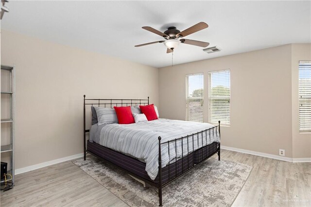 6009 Midcrown Dr, San Antonio, TX 78218 - bedroom with wood finished floors, baseboards, and ceiling fan