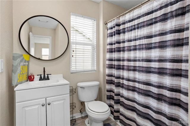 6009 Midcrown Dr, San Antonio, TX 78218 - full bathroom with vanity, toilet, and curtained shower