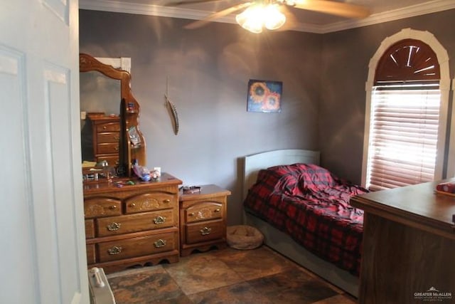 bedroom with ceiling fan and crown molding