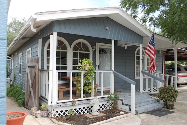 exterior space with a carport and covered porch