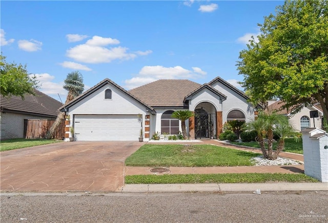 612 Persimmon Ave, Edinburg, TX 78539 - view of front of house featuring driveway, an attached garage, stucco siding, and a tiled roof
