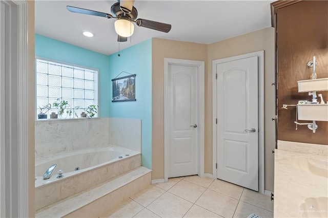 612 Persimmon Ave, Edinburg, TX 78539 - full bathroom with tile patterned floors, a tub with jets, ceiling fan, double vanity, and a closet